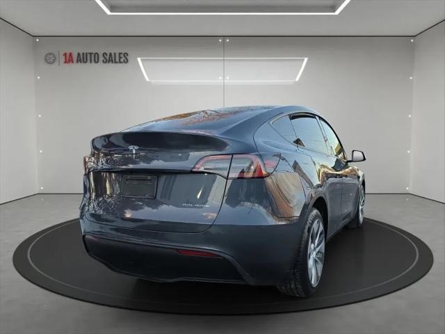 used 2023 Tesla Model Y car, priced at $34,995