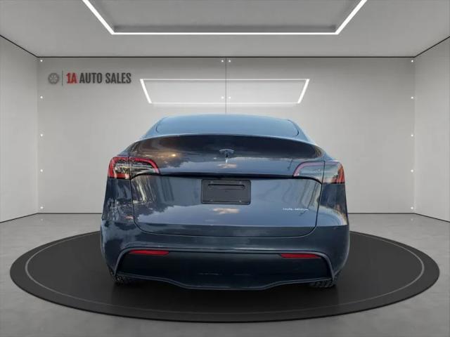 used 2023 Tesla Model Y car, priced at $34,995