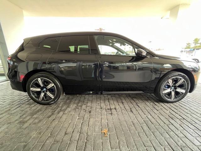 new 2024 BMW iX car, priced at $94,295