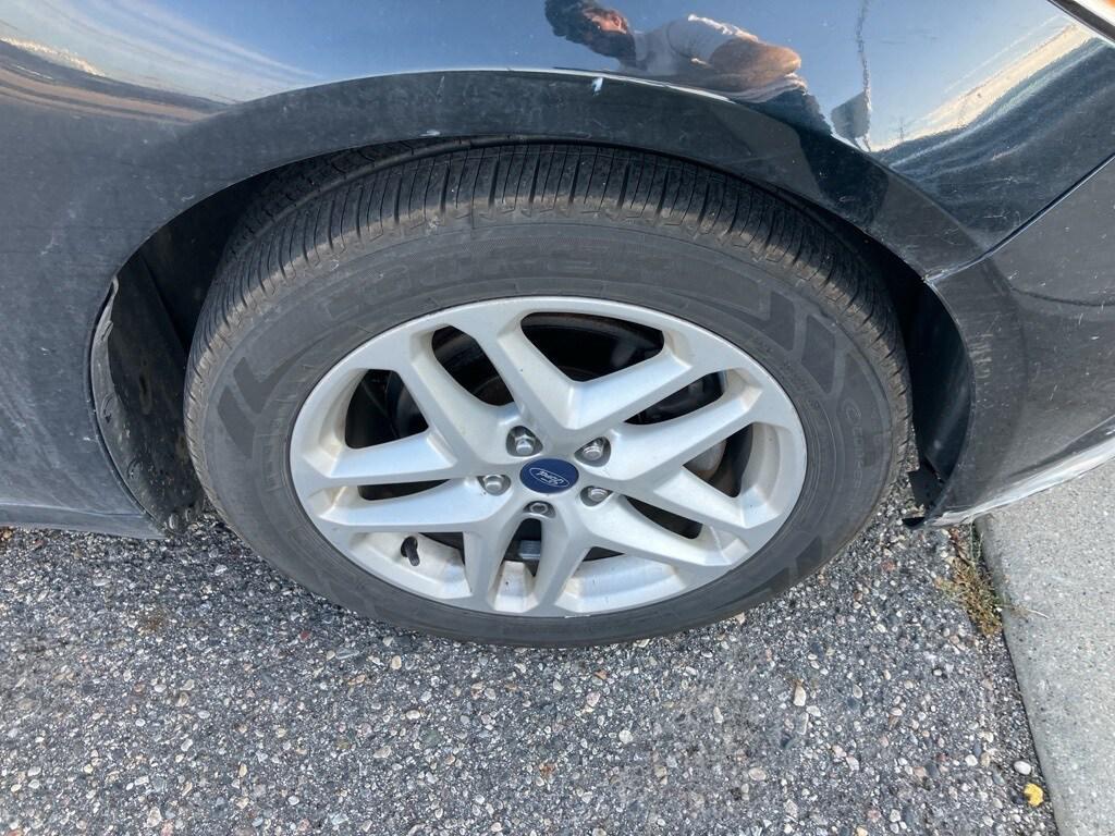 used 2014 Ford Fusion car, priced at $7,000