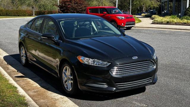 used 2014 Ford Fusion car, priced at $6,990