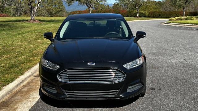 used 2014 Ford Fusion car, priced at $6,990