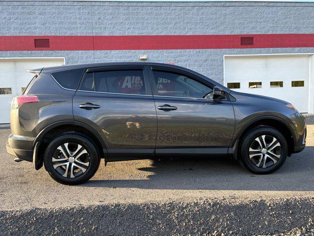 used 2018 Toyota RAV4 car, priced at $15,000