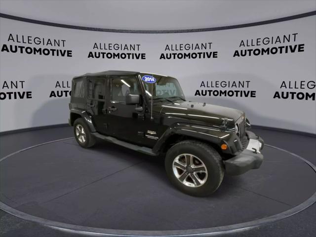 used 2014 Jeep Wrangler Unlimited car, priced at $19,117