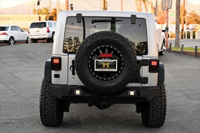 used 2014 Jeep Wrangler Unlimited car, priced at $22,850