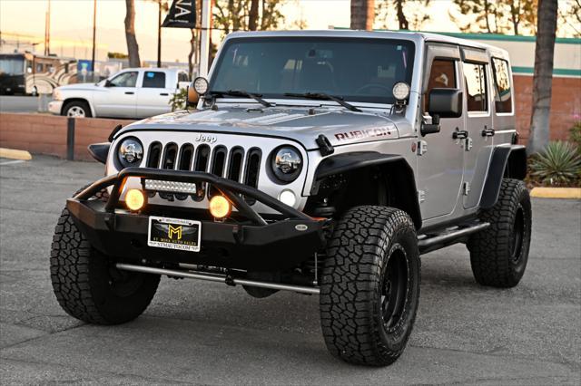 used 2014 Jeep Wrangler Unlimited car, priced at $22,850