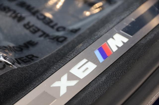 used 2022 BMW X6 M car, priced at $85,000
