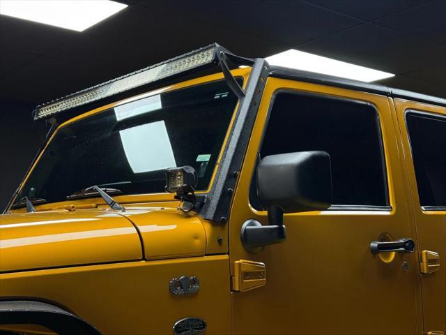 used 2014 Jeep Wrangler Unlimited car, priced at $18,997