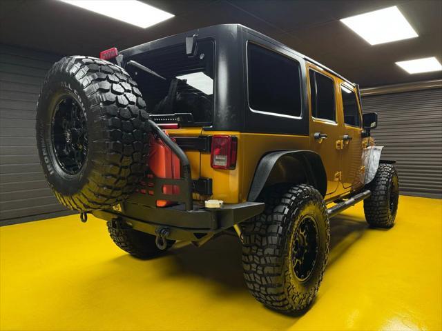 used 2014 Jeep Wrangler Unlimited car, priced at $18,997