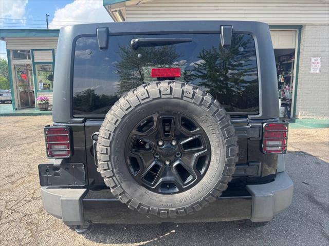 used 2014 Jeep Wrangler Unlimited car, priced at $11,995