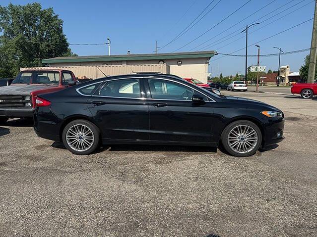 used 2015 Ford Fusion car, priced at $6,995