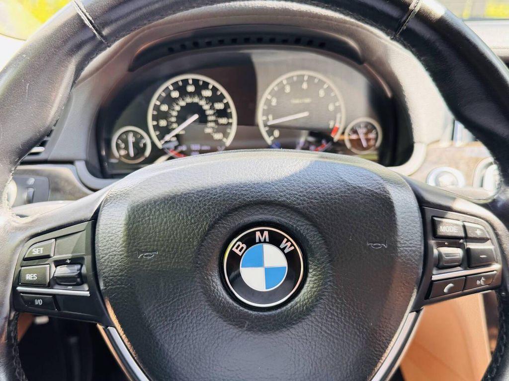 used 2013 BMW 750 car, priced at $7,999