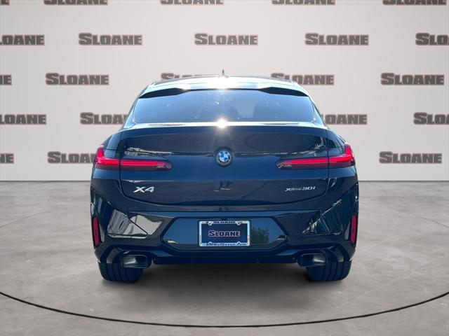 used 2025 BMW X4 car, priced at $60,891