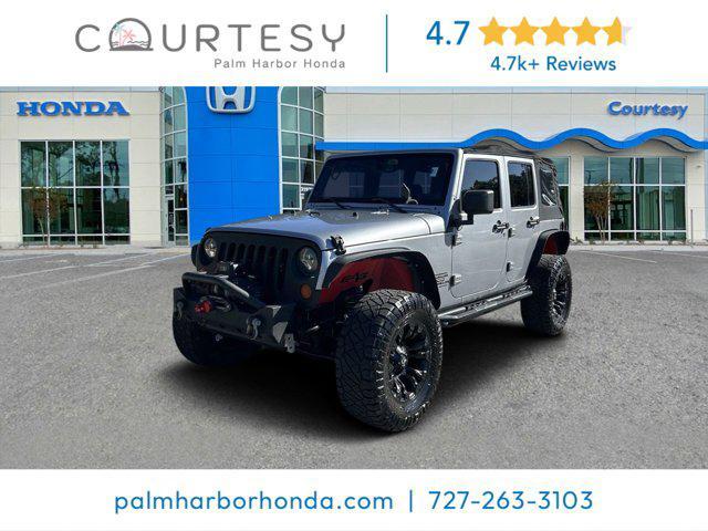 used 2014 Jeep Wrangler Unlimited car, priced at $16,152