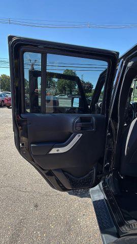 used 2015 Jeep Wrangler Unlimited car, priced at $11,477