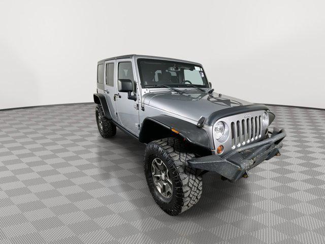 used 2013 Jeep Wrangler Unlimited car, priced at $17,699