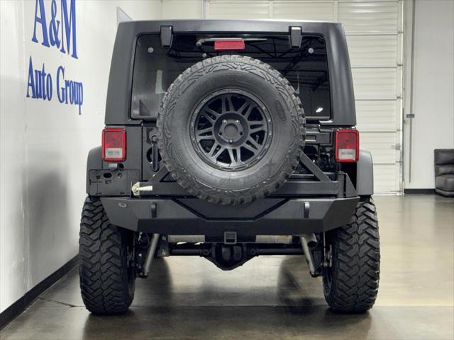 used 2014 Jeep Wrangler Unlimited car, priced at $23,995