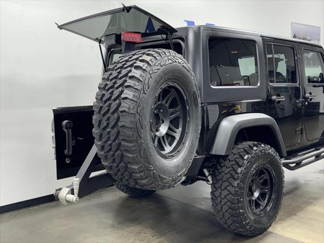 used 2014 Jeep Wrangler Unlimited car, priced at $23,995