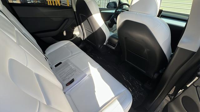 used 2023 Tesla Model Y car, priced at $37,128