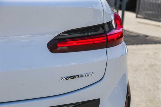 used 2025 BMW X4 car, priced at $54,994