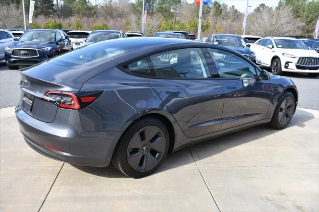 used 2023 Tesla Model 3 car, priced at $27,359