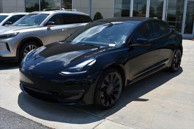used 2023 Tesla Model 3 car, priced at $34,490