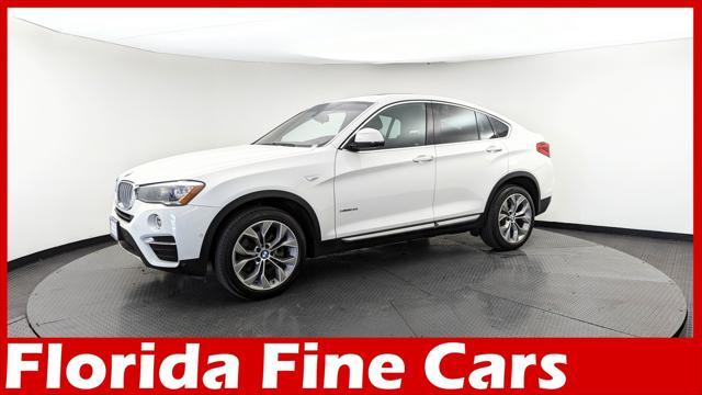 used 2018 BMW X4 car, priced at $19,499