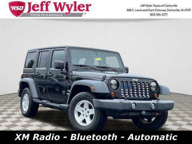 used 2012 Jeep Wrangler Unlimited car, priced at $13,076