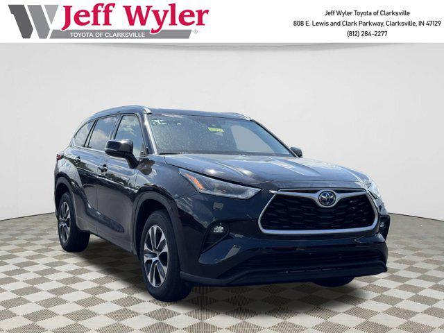 used 2021 Toyota Highlander Hybrid car, priced at $30,394