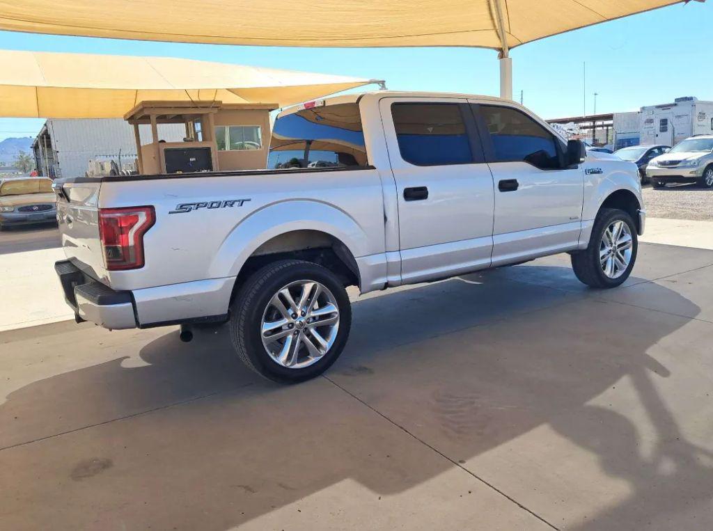used 2015 Ford F-150 car, priced at $14,000