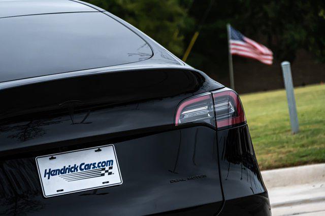 used 2025 Tesla Model Y car, priced at $39,897