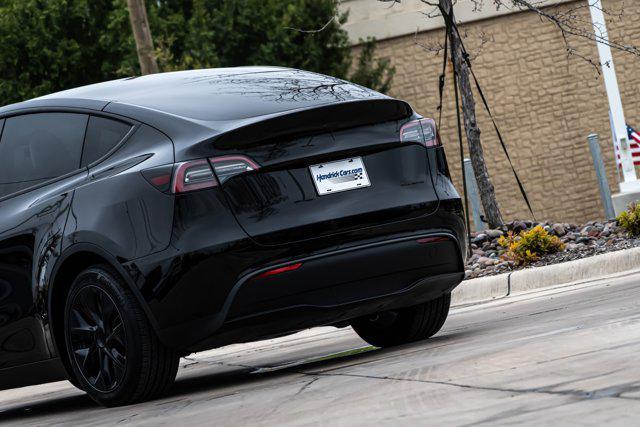used 2025 Tesla Model Y car, priced at $39,897
