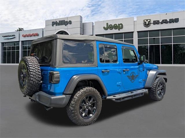 used 2023 Jeep Wrangler car, priced at $37,339