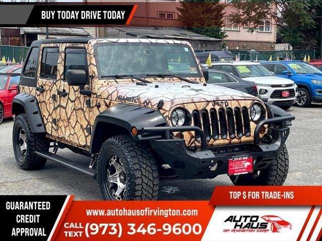 used 2011 Jeep Wrangler Unlimited car, priced at $16,995