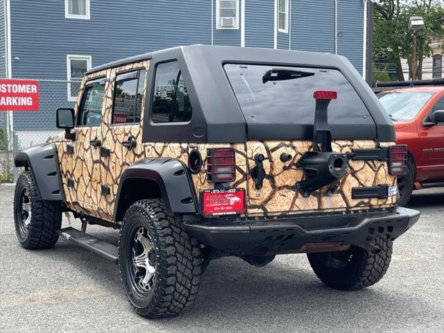 used 2011 Jeep Wrangler Unlimited car, priced at $16,995