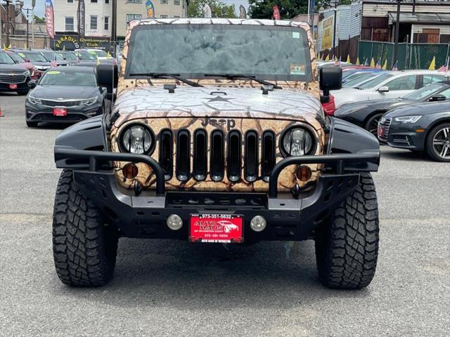 used 2011 Jeep Wrangler Unlimited car, priced at $16,995