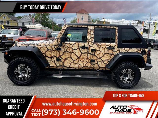 used 2011 Jeep Wrangler Unlimited car, priced at $16,995