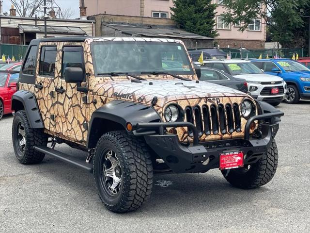used 2011 Jeep Wrangler Unlimited car, priced at $16,995