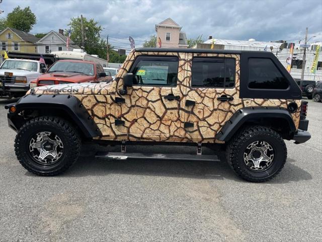 used 2011 Jeep Wrangler Unlimited car, priced at $16,995