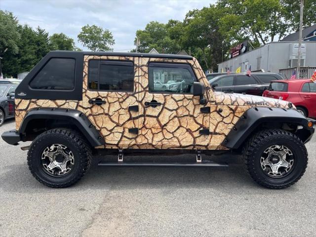 used 2011 Jeep Wrangler Unlimited car, priced at $16,995