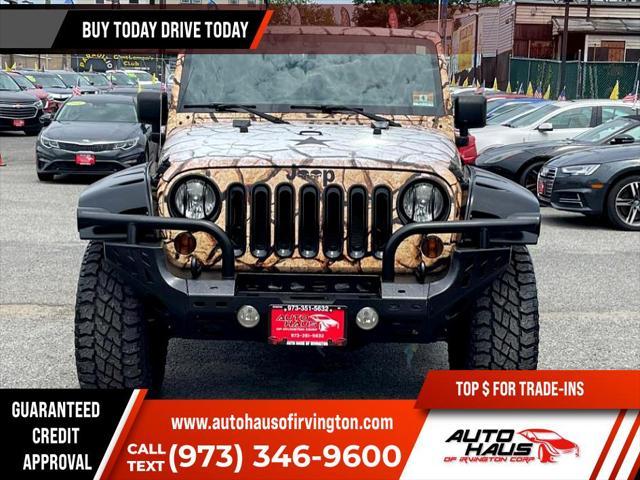 used 2011 Jeep Wrangler Unlimited car, priced at $16,995