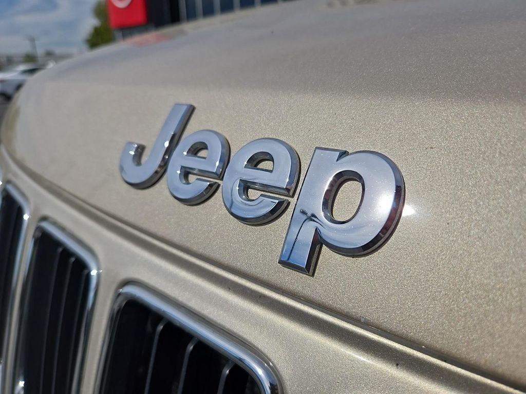 used 2014 Jeep Grand Cherokee car, priced at $14,355