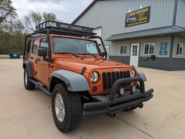 used 2011 Jeep Wrangler Unlimited car, priced at $17,479