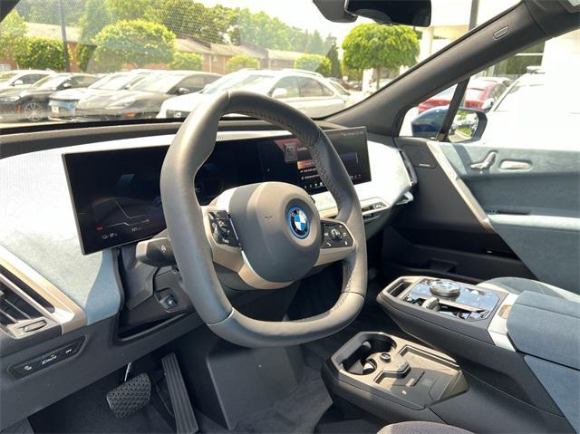 new 2025 BMW iX car, priced at $97,425