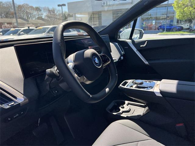 new 2024 BMW iX car, priced at $94,446