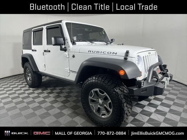 used 2013 Jeep Wrangler Unlimited car, priced at $26,964