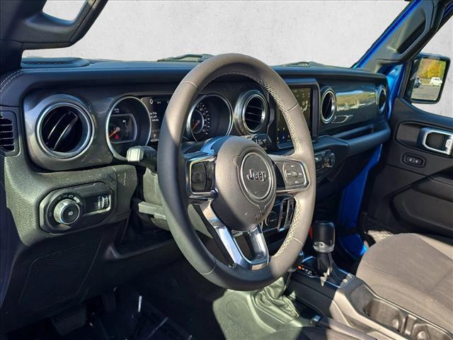used 2023 Jeep Wrangler car, priced at $34,369