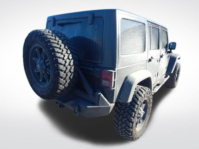 used 2011 Jeep Wrangler Unlimited car, priced at $16,497