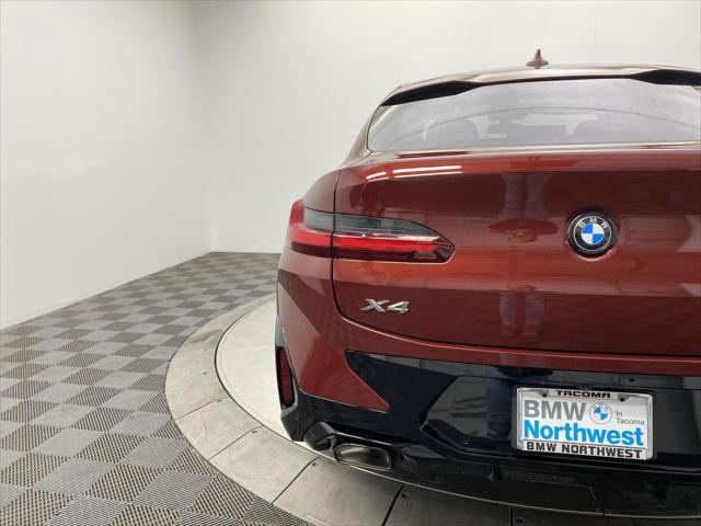 used 2025 BMW X4 car, priced at $58,997