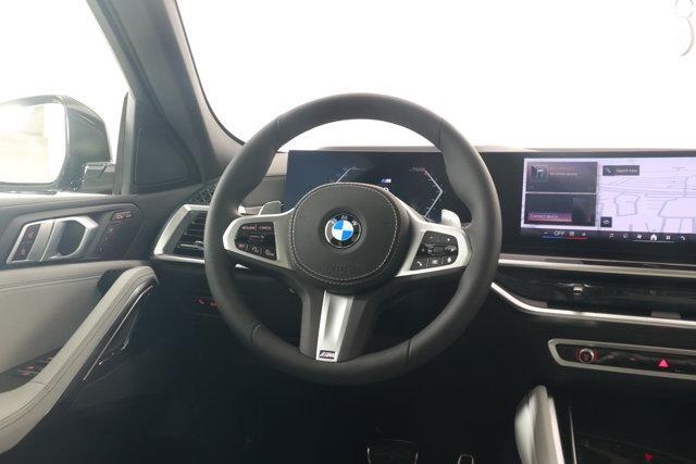 new 2025 BMW X6 car, priced at $77,875